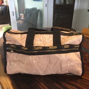 Light pink Patent duffle by LeSportsac
